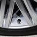 A signature Bentley B on the tire air cap on the new Continental GT Speed Convertible during a press presentation at the North American International Auto Show during the press preview on Monday, Jan. 14, at Cobo Center in Detroit.   Melanie Maxwell I AnnArbor.com 